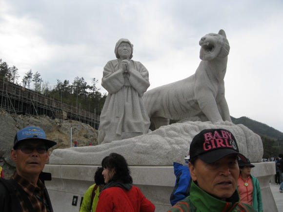 The statue of the myth behind the sea parting, a grandmother prayed for her family to visit her on an island, and the gods answered. The sea parted! Also look at this guy's hat, 