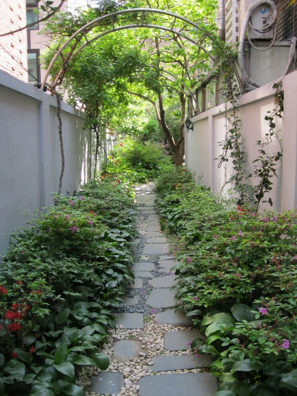 a hidden passageway leading to someone's backyard