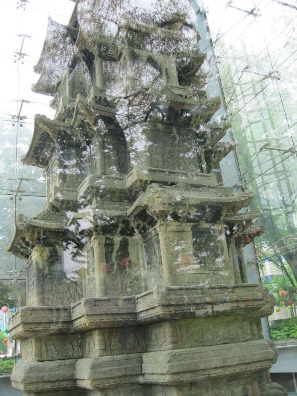 a very very old statue. so old, it was enclosed in glass!